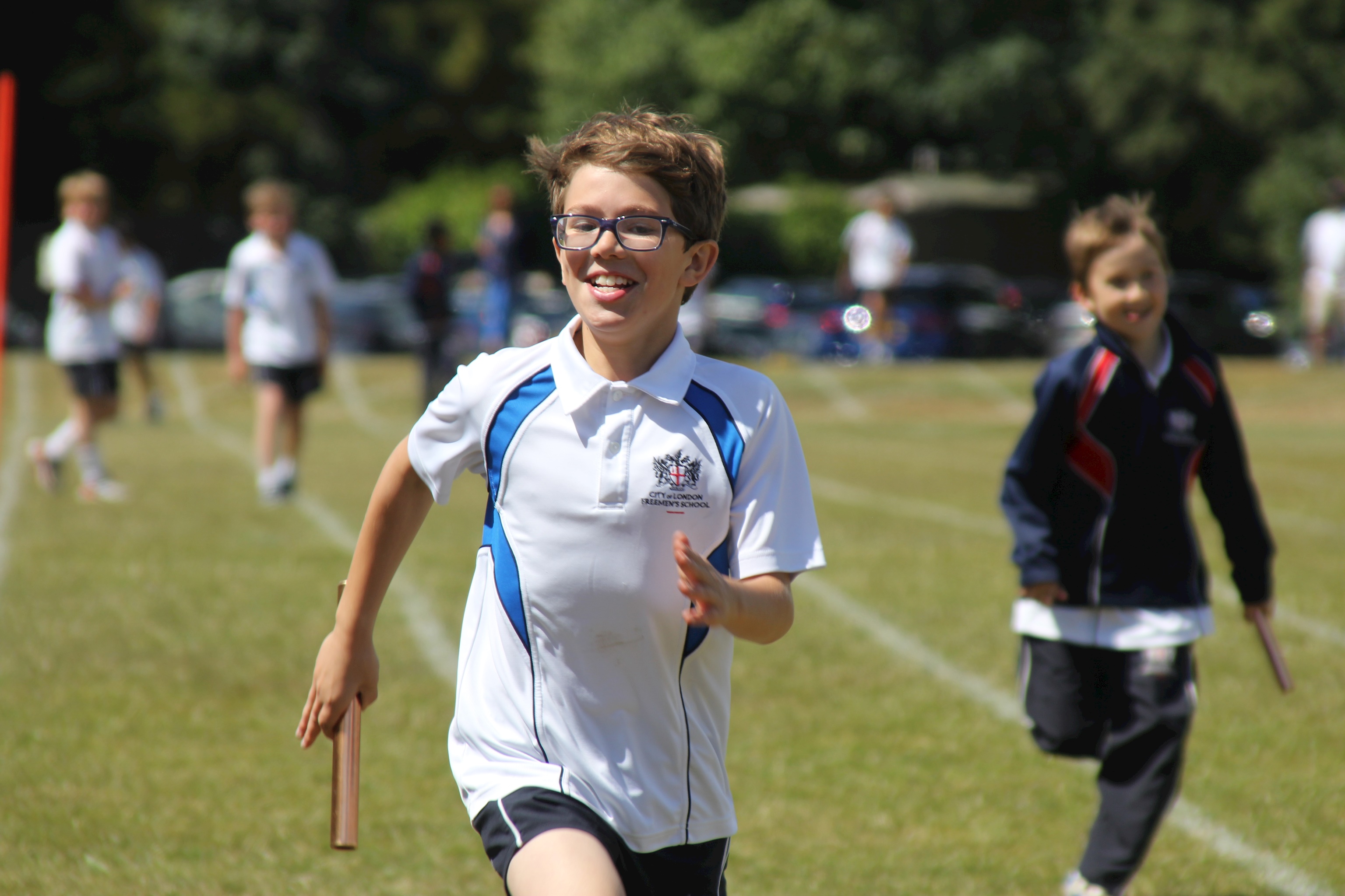 Happy boy winning a sprint relay race